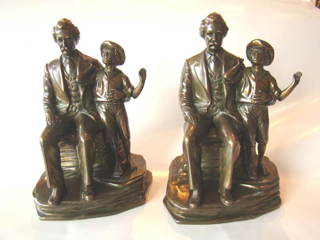 An extremely rare pair of vintage Mark Twain and Tom Sawyer bookends by Jennings Brothers circa 1936
